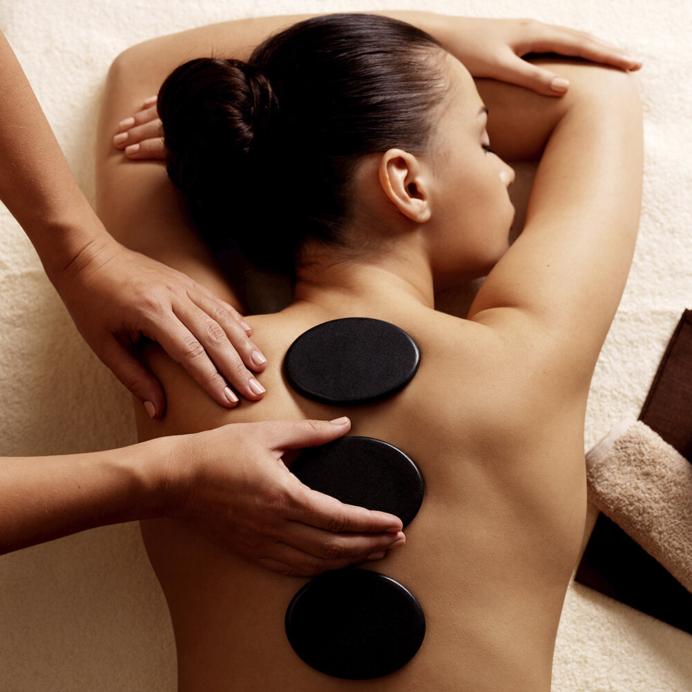 What Are the Health Benefits of a Hot Rock Massage Therapy?